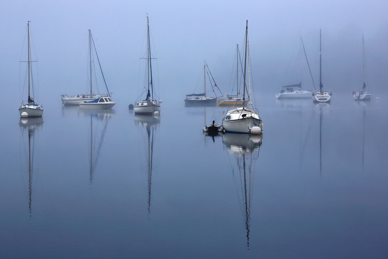 Reflections in the mist on Windermere by Martin Lawrence Photography