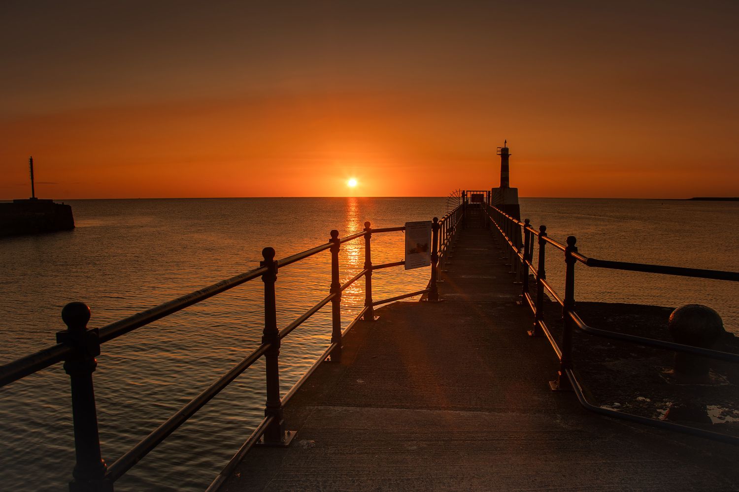 Dramatic sunrise over Amble Lighthouse on the Northumberland Coast by Martin Lawrence Photography