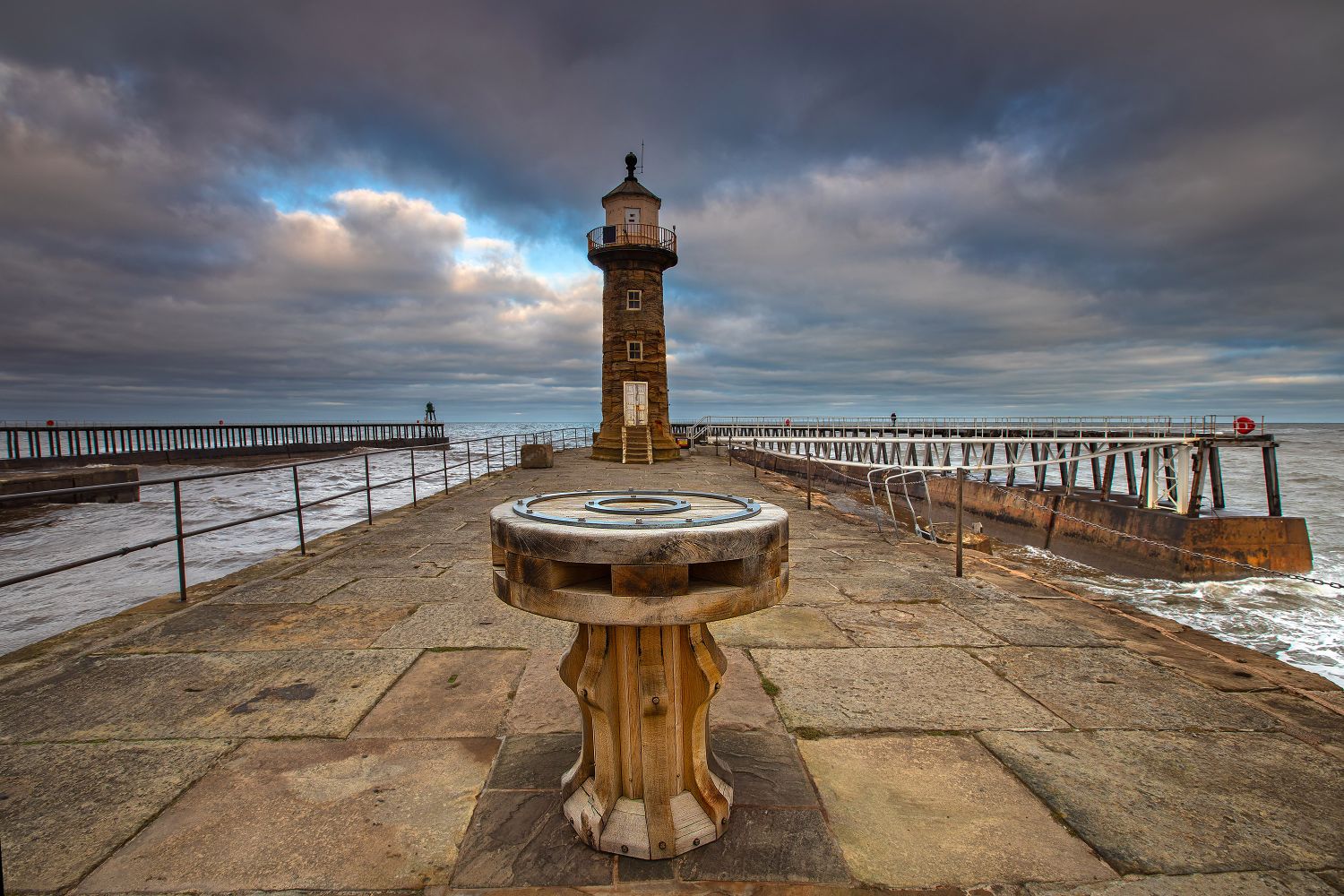 Early morning light over Whitby Harbour Lighthouse by Martin Lawrence Photography