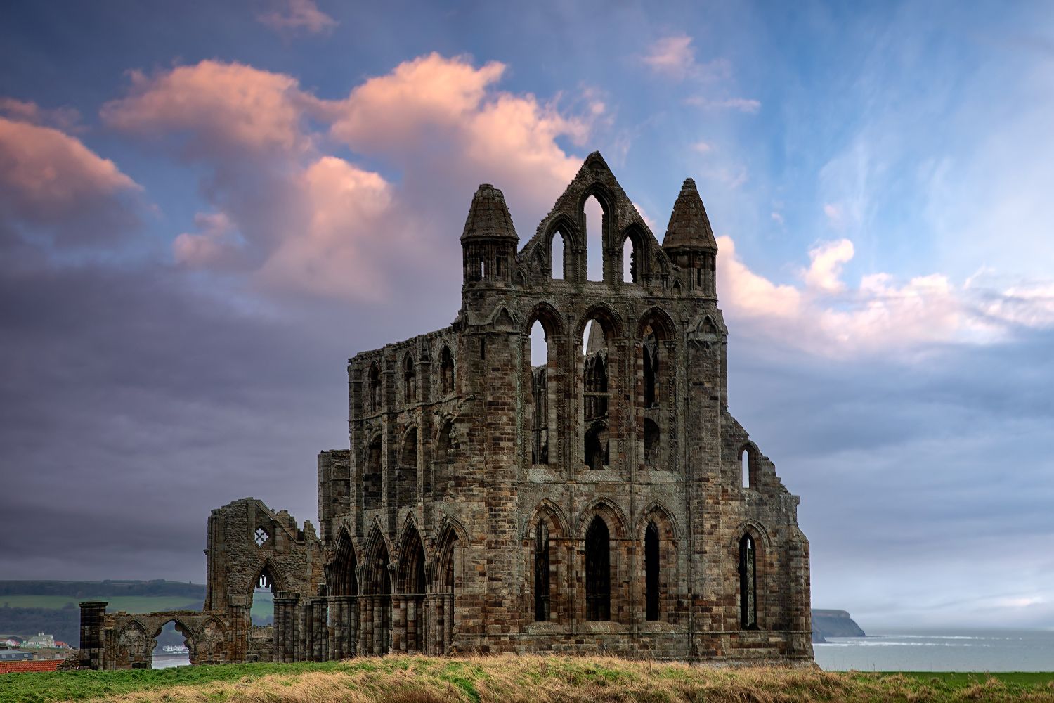 Sunset over Whitby Abbey late on in the season by Martin Lawrence Photography