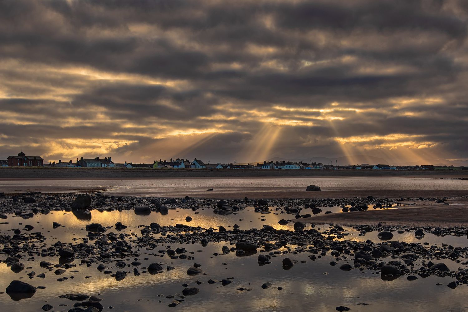 Early morning sun rays over Allonby by Martin Lawrence Photography